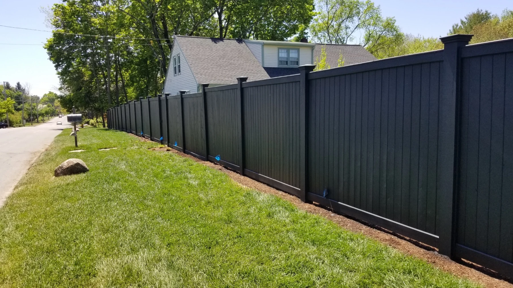 Black privacy fence installation